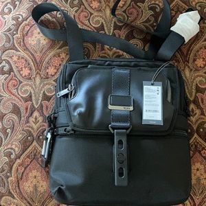 Brand new with tag! 12.5 X 11.25 X 2.25.  Unisex